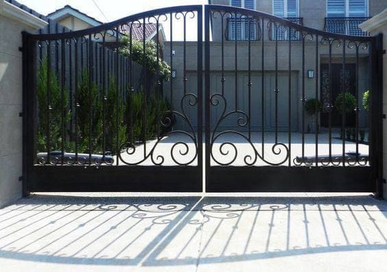 Elaborate wrought iron gate with floral motifs